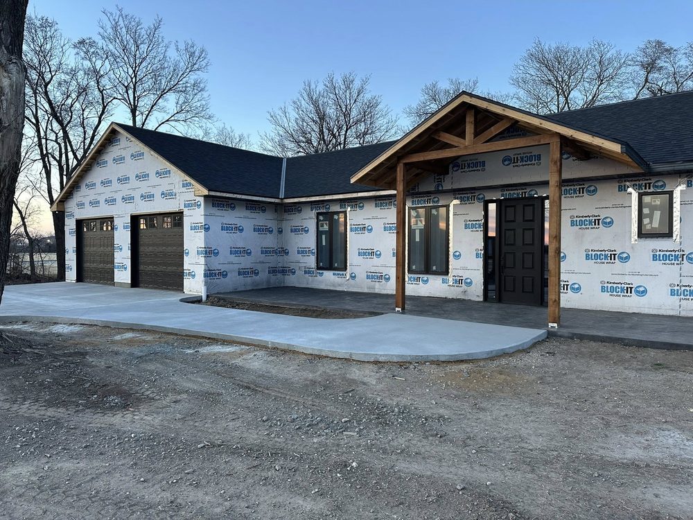 Custom home with finished stone facade and timber-frame porch