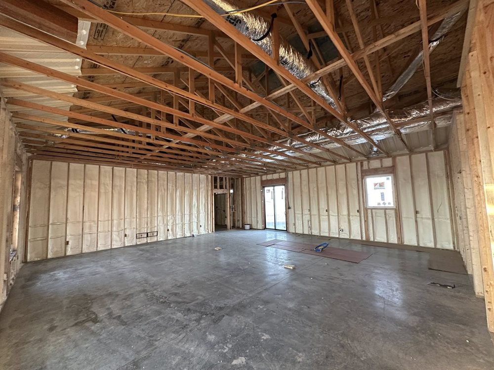 Roof trusses set over the framed interior