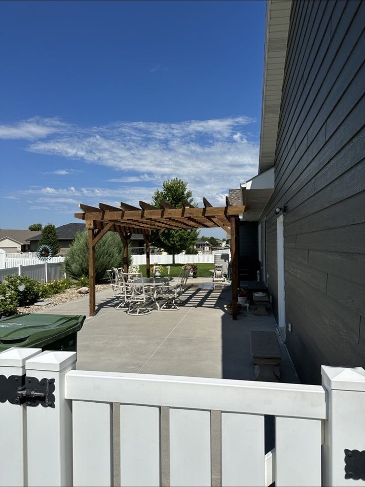 Backyard pergola over a concrete patio