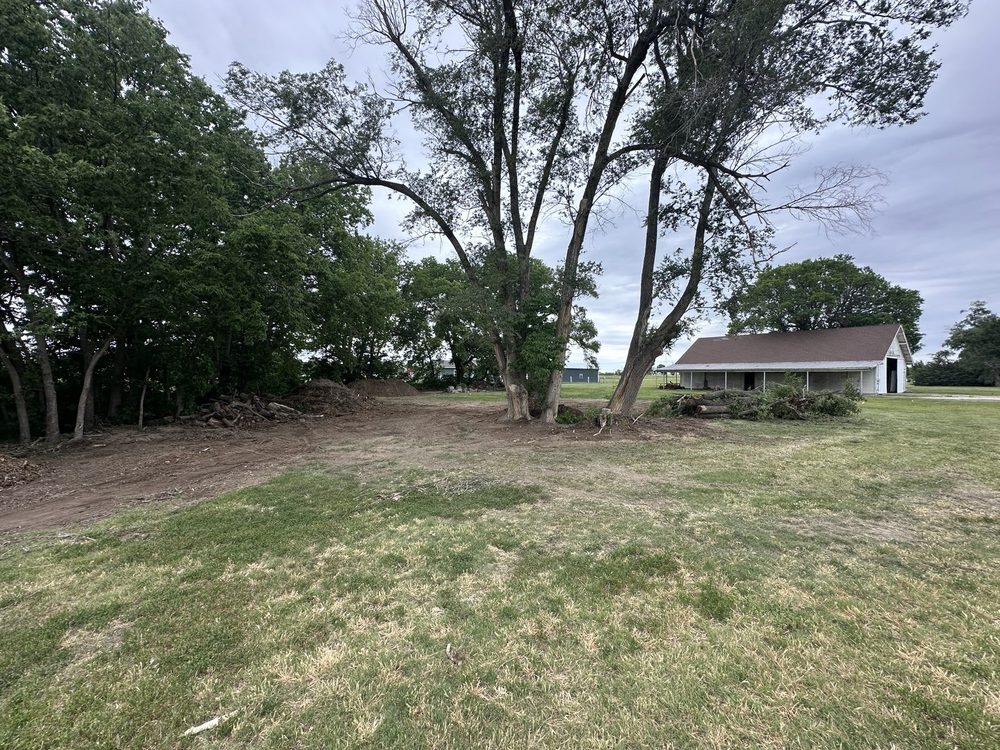 Finished grading and landscaping with home in background